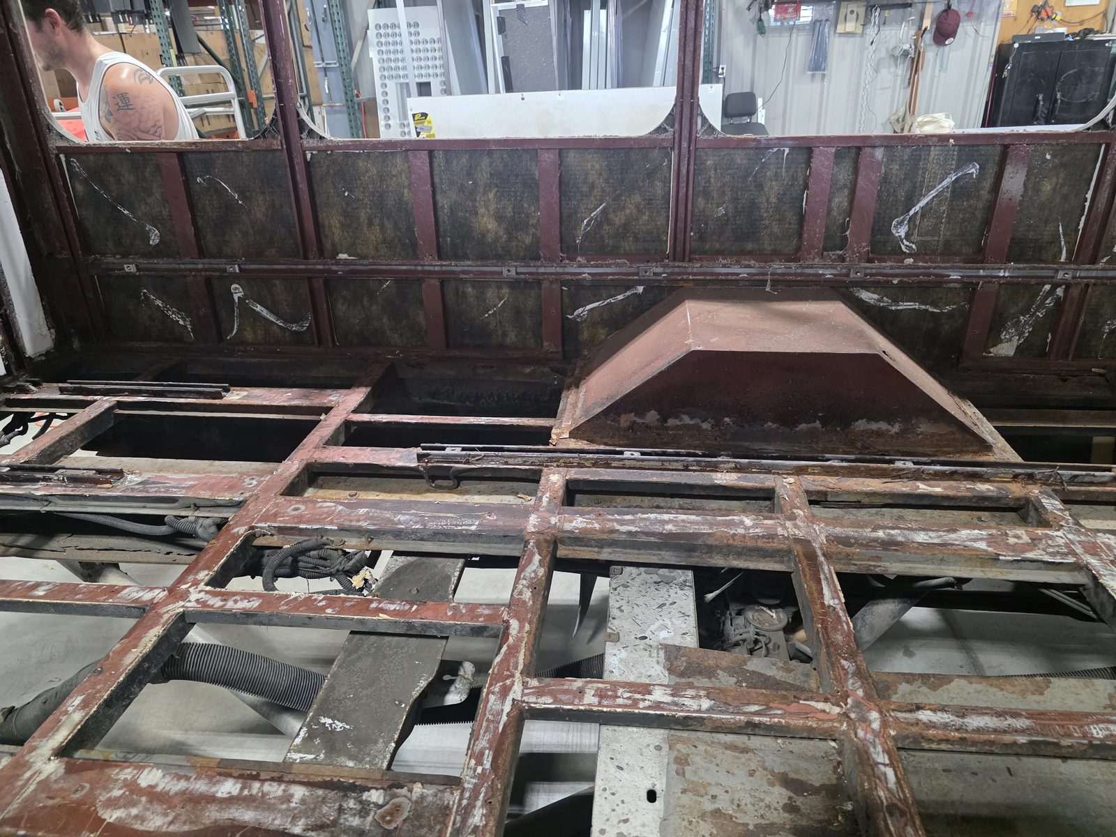 Rear floor structure and wheel wells exposed during teardown